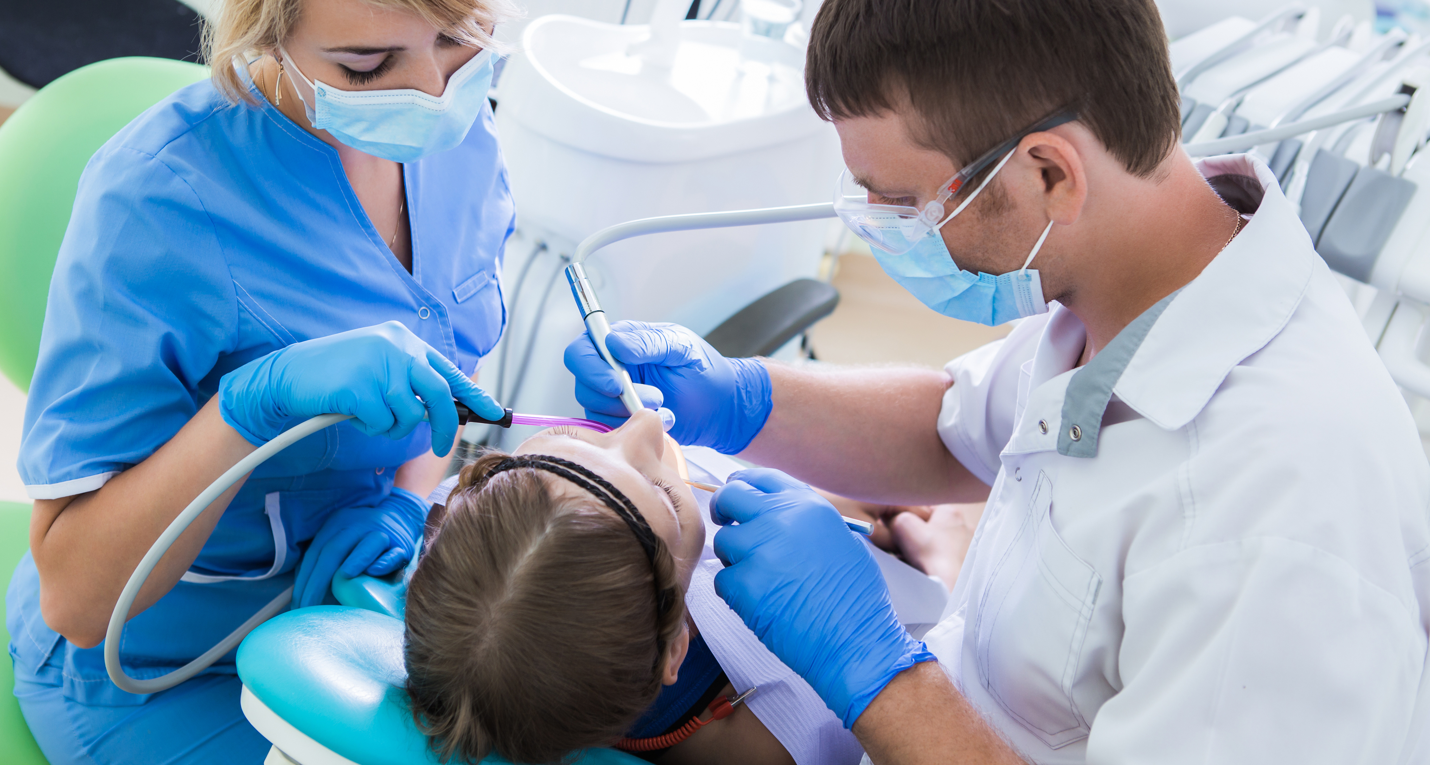 Oral surgery dentists with patient